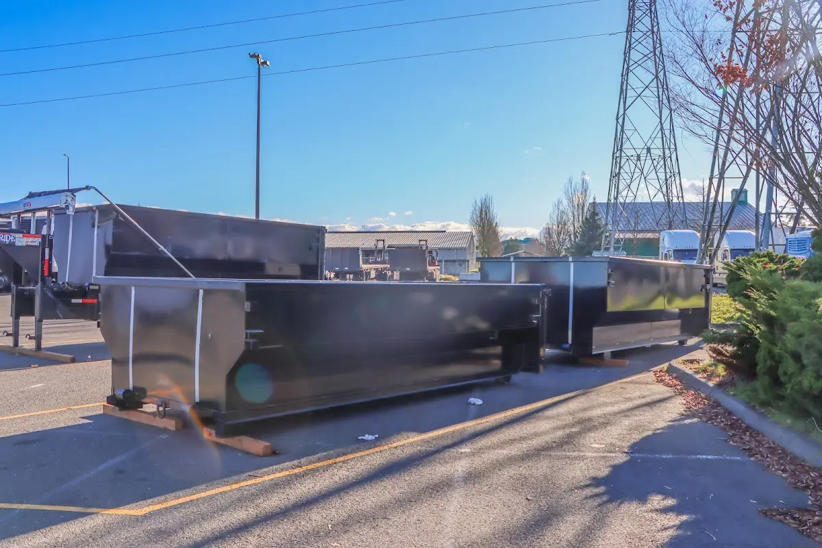 Roll-off dumpster ready for waste disposal at job site for Roofing Dumpster Rental in Upton